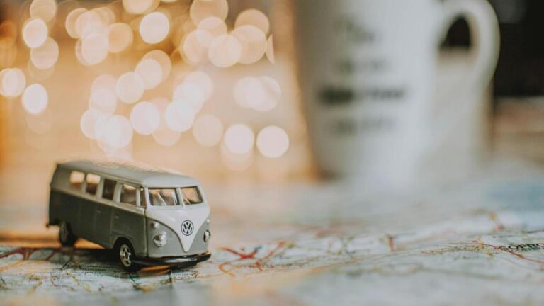 A toy car upon a map, ready to travel